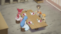 The girls sit down to eat