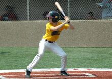 Noam playing Baseball